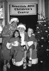 The Arthurs played Santa and Mrs. Claus at a children's center.
Submitted photo.