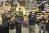 Alaska Division of Agriculture Communications Director Dan Saddler and Director Dave Schade present Fred Meyer Produce Manager Parker Collins and Store Manager Dean Forkner with the 2021 Gold