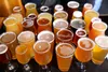 Beer is fermented by yeast, which breaks down sugars into alcohols.