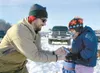 ROBERT DeBERRY/Frontiersman file photo Bill Hobbins helps his
daughter, Lauren, 4, with a trout during the Gettin Jiggy 2010 Kids
Ice Fishing Derby on Knik lake.