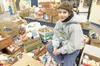 ROBERT DeBERRY/Frontiersman Palmer Junior Middle School student
Kevin Christopher, 13, rallied his classmates over the past weeks
to gather more than 5,000 items of food for the Palmer Food
B