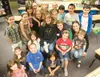 ROBERT DeBERRY/Frontiersman Parents and students of Kendra
Pepperd’s second-grade class gather around her for a photo Friday
afternoon at Iditarod Elementary. Pepperd has been teaching 27
yea
