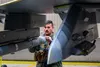 U.S. Air Force Captain Aaron Doyle, 14th Fighter Squadron wing flight safety officer, performs a pre-flight inspection on his F-16 Fighting Falcon at Eielson Air Force Base, Alaska, during RE