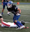 Palmer senior Reed Craner breaks a tackle during a win over Juneau-Douglas. Bruce Eggleston/matusports.net