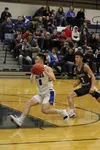 Dae Osiensky drives to the basket Photos by Tim Rockey/Frontiersman