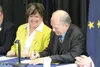 Gov. Bill Walker signs House Bill 161, authored by Alaska Rep. Lynn Gattis, left, at the Wasilla Senior Center Tuesday afternoon. The bill requires recipients of health benefits to obtain use