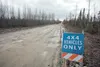 A ‘4x4 vehicles only’ sign sits along the edge of Pond Lilly Lane as a warning of what road condition are like ahead. ROBERT DeBERRY/Frontiersman.com