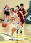 Houston's Cole Taylor brings the ball across midcourt during a win over Mount Edgecumbe. Bruce Eggleston/matsusports.net