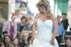 Meg Lum turns for the crowd while walking across the stage Saturday during the Bridal Fashion Show at the Today’s Woman Show at the Curtis D. Menard Memorial Sports Center in Wasilla. ROBERT 