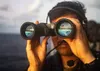221129-N-YS413-2006 SPRATLEY ISLANDS, South China Sea (Nov. 29, 2022) Seaman Robert Torres, from Orlando, Florida, scans for surface contacts on the bridge wing as the Ticonderoga-class guide