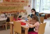 Megan Luke and her daughters Evelyn and Jailynn enjoy an art activity during Wasilla Public Library's five year anniversary at the new location. Jacob Mann/Frontiersman
