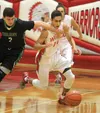 Colony's Bailey West and Alex Baham battle for a loose ball during Colony's 49-47 win over Wasilla. Courtesy of Bruce Eggleston/mats