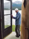 Ed Musial walks through his back door showing how close the Matanuska River has come to his house in the last few days. The Musials’ claim on the property dates to 1952. BRIAN O’CONNOR/Fronti