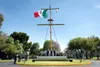 The Mexican flag flies over a Mexican navy memorial in Mexico City, Mexico.