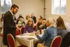 Rabbi Mendy Greenberg speaks with guests during the 2024 Passover celebration. Courtesy photo