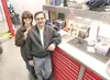 ROBERT DeBERRY/Frontiersman Cindy and Ron Causa stand inside
their new auto shop at Mile 5.5 of Knik-Goose Bay Road.
