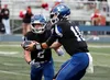 Palmer quarterback Nolan Garner hands the ball off to Corbin Gerkin during a recent win over Juneau-Douglas. Gerkin scored a pair of touchdowns during a victory over Eagle River Friday. Bruce