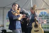 Chris Jamison, his childhood friend Sam, and new friend, Janet Dinwiddie (general manager for Pyrah's Pioneer Peak Farm) petting puppies, post-concert. JACOB MANN/Frontiersman.com