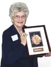 Audrey Leighton holds her CLIA award, which is given annually by
the Alaska Center for the Book to those making contributions to
literacy in the state. CASEY RESSLER/Frontiersman
