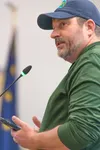 Michael Bowles, a candidate for Mat-Su Assembly District 1, spoke out against the 7 cents fuel tax during the public comment portion of the assembly meeting. J. David McChesney/Frontiersman