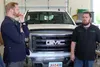 Jeremy Field, Small Business Association regional administrator for the Pacific Northwest, talks with Distinctive Rides owner Spencer Richardson during a visit to the Wasilla business Tuesday