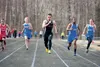 Houston senior Charlie Buzby, center, leads the group of runners as they near the finish in the boys’ 100-meter dash Monday afternoon in the 2013 Last Chance Qualifier at Veterans Memorial Fi