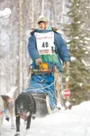 ROBERT DeBERRY/Frontiersman Knik musher Wade Marrs, 18, crests a
hill before heading onto Crystal Lake during the restart of the
2009 Iditarod Trail Sled Dog Race Sunday in Willow. Marrs is t