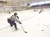 ROBERT DeBERRY/Frontiersman Adam Friese reaches out for the puck
during an Alaska Avalanche practice Thursday afternoon at the
Curtis C. Menard Memorial Ice Rink in Wasilla.