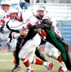 East quarterback Derek Laws is sacked by Colony defensive end
Caleb Moffit during the second quarter of the Thunderbirds' 42-35
overtime win over the Knights in the semifinals of the state
fo