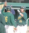 JEREMIAH BARTZ/Frontiersman Mat-Su infielder Shane Brown, left,
congratulates Jonathon Cisneros at home plate after Cisneros hit a
two-run home run to give the Miners the early lead.