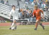 ROBERT DeBERRY/Frontiersman Colony senior Bridger Van Ness moves
the ball toward the goal as Wasilla senior Aaron Sharrow tries to
chase him down Saturday at Palmer High School during the Nor