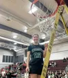 Colony senior Hallie Clark cuts down the net after the Knights won the Northern Lights Conference title. Courtesy of Colony High School