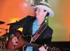 Ken Peltier along with the Ken Peltier Band entertains the crowd
at Friday's Santa Cop and Heroes Barn Dance fundraiser at the
Curtis D. Menard Memorial Sports Center in Wasilla. (ROBERT
DeBE