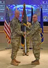 Air Force Gen. Jay Raymond, Air Force Space Command commander, left, presents colors to Army Brig. Gen James Thomas, to recognize the establishment of Joint Task Force-Space Defense during a 