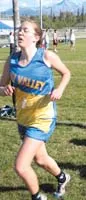 Su Valley's Melissa Ostermick crosses the finish line to win the
girls' race at the 2003 Mat-Su Borough Cross-Country Meet at Colony
High School on Wednesday. STEVE KADEL/ Frontiersman.