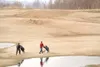 ROBERT DeBERRY/Frontiersman Will Fernandez, right, and Richard
Eigelis walk between water hazards Monday while golfing at the
Fishhook Golf Course in Palmer Monday afternoon.