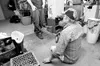 ROBERT DeBERRY/Frontiersman Jim White uses his hands to help
scoot across the floor in his home off Knik-Goose Bay Road.