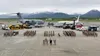 Members of the 673d Air Base Wing stand on the flight line at Joint Base Elmendorf-Richardson, Alaska, June 2, 2023. The 673d ABW comprises of over 5,500 joint military and civilian personnel