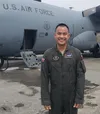 Lt. Col. Saksorn Fhaikhao, Royal Thai Air Force C-130 Hercules instructor pilot, stands in front of a C-130H3 at Dobbins Air Reserve Base, Ga., while serving with the 94th Airlift Wing as par