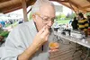 ROBERT DeBERRY/Frontiersman Big Lake resident Jim Shake takes a
taste of chili at theFall Festival and Chili Cookoff in Big Lake
Saturday afternoon.