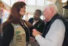 Ellie Hakari receives a Girl Scout Gold Award Monday afternoon from Alaska Veterans and Pioneers Home Resident Council President Ed Willis and Tasha Nichols, Girl Scouts of Alaska director of