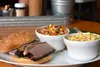 A briscut sandwhich and two sides are among the menu options at Bears Belly BBQ RJ Johnson/For the Frontiersman