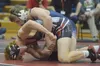 Bechler Metcalf of Soldotna wrestles with Wasilla's Andrue Shepersky in the 152-pound championship bout at the Northern Lights Conference tournament Saturday at Kenai Central High School. Pho