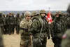 U.S. Army Capt. Kevin Krupp, assigned to 5th Battalion, 4th Air Defense Artillery Regiment, receives an award from Polish Col. Sławomir Kojło, assigned to 3rd Air Defense Rocket Brigade, for 