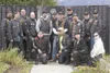 Members of the Combat Veterans Motorcycle Association stand in
front of the Wall of Honor in Wasilla. (ROBERT
DeBERRY/Frontiersman) Robert DeBerry