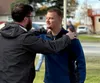 “This is just our little way of everyone coming together and showing support to each other," said Eric Farnsworth, who works with the Mobile Crisis Unit, here with Daniel Cuculia during the 4