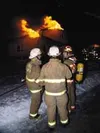 Flames leap from a home on Iroquois on Monday night. Photo
courtesy of BOB MARTINSON.