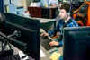 Wasilla Police Department dispatcher takes a call at the WPD building in Wasilla. Dispatch responds to 24,000 calls in a month, according to Mayor Bert Cottle. Katie Stark/For the Frontiersma