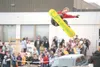Jason Borgstede, a Shredfest organizer, executes a 360 grab for
students at Wasilla Middle School during Monday's snowboarding
exhibition. Shredfest is in its fifth year as a tool to help
enc