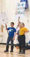 Nearly 100 students, family members, and staff turned out to rally support for Larson Elementary, as well as the other schools facing proposed closures. Some brought signs and held them throu